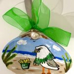 Gull in Swoop Mask Hand Painted Philadelphia Eagles football shell ornament